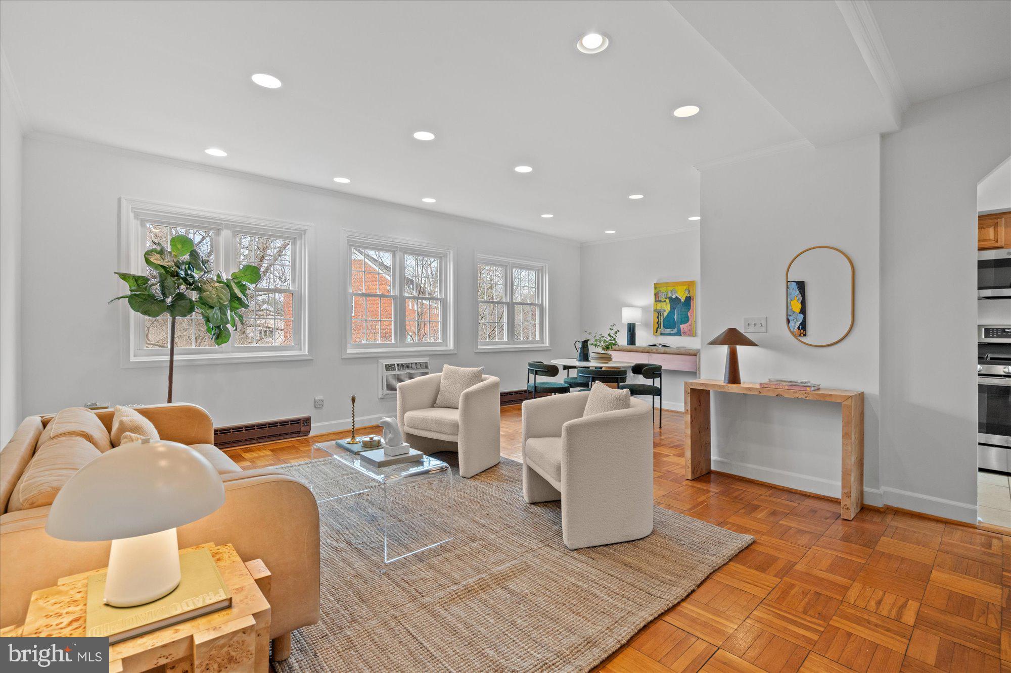 3206 Gunston Road Alexandria, VA 22302 - Photo 3 of 25 a living room with a couch and a potted plant