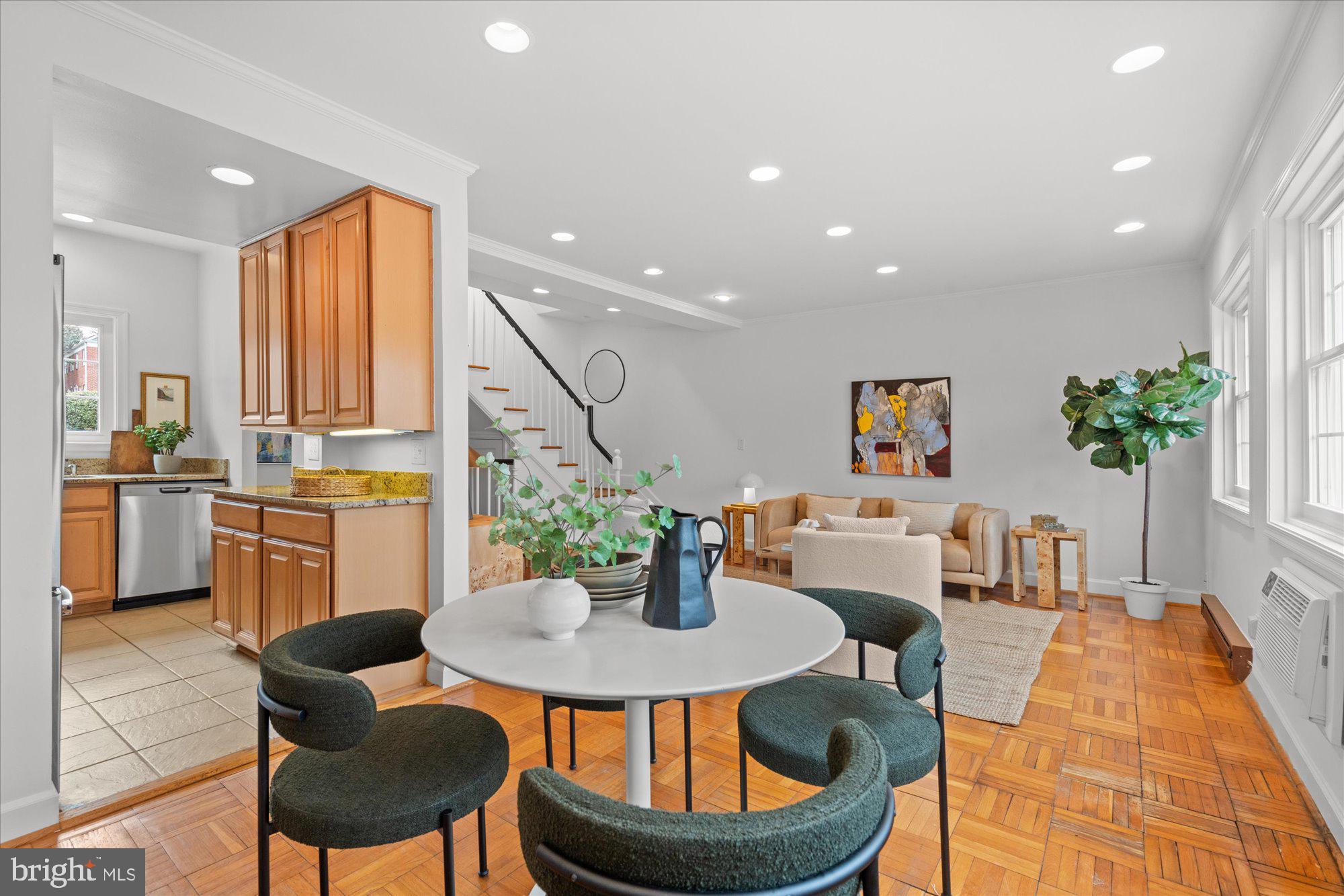 3206 Gunston Road Alexandria, VA 22302 - Photo 8 of 25 a kitchen with dining table and chairs