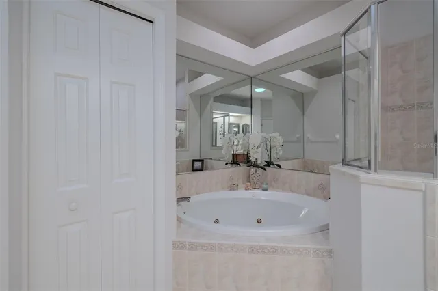 a bathroom with a sink a mirror and a bathtub