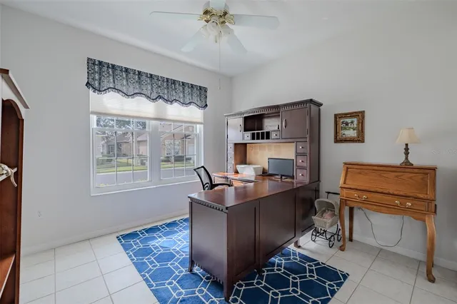 a work room with furniture and a window