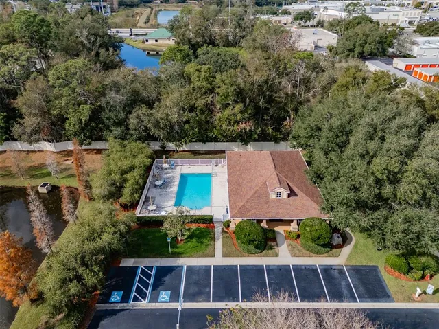 an aerial view of house with a yard