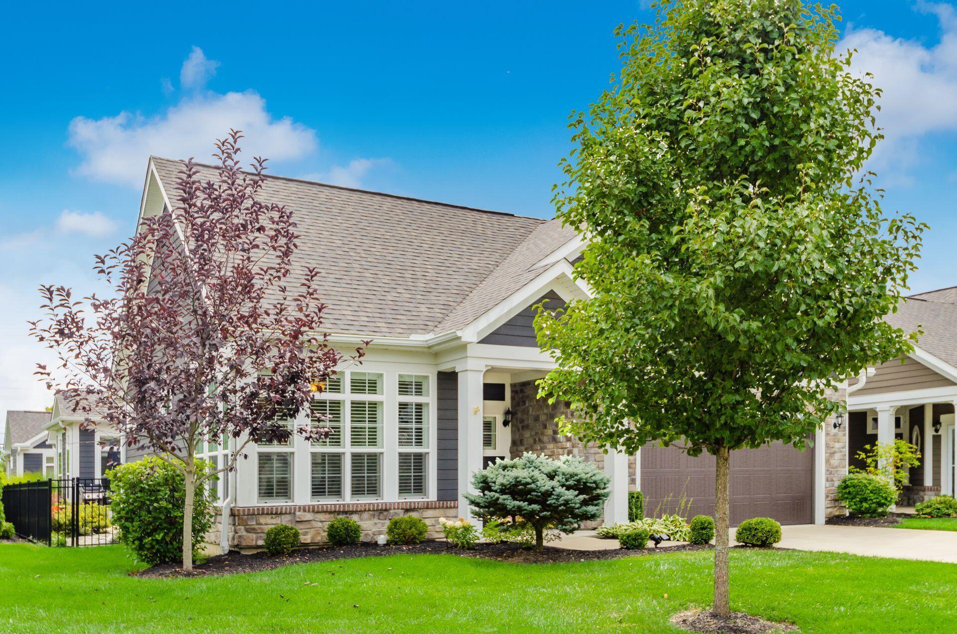 6960 Morningstar Loop Westerville, OH 43082 - Photo 2 of 47 The meticulous landscaping enhances the appeal of this fantastic condo.