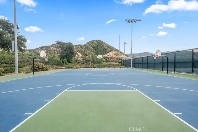 a view of a house with a balcony and large windows