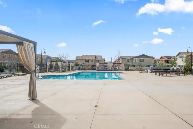 a view of a patio with a table and chairs