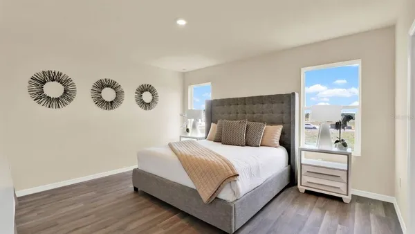 a bedroom with a bed and a table