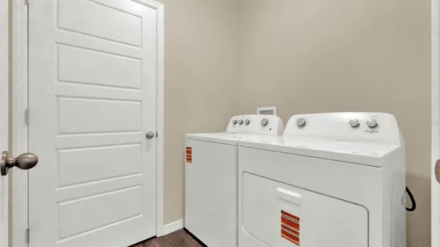 a utility room with dryer and washer