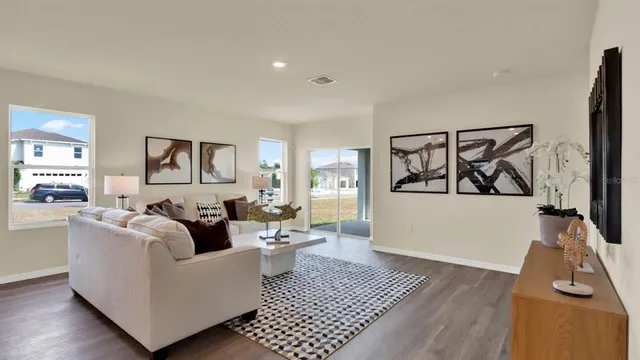 a living room with furniture and a rug
