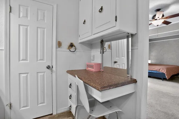 a kitchen with a table and chairs