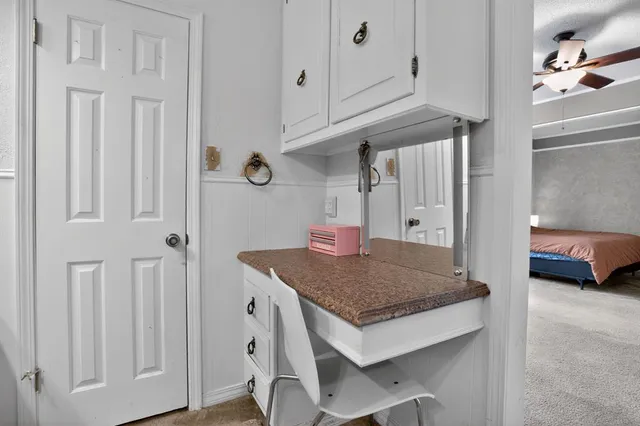 a kitchen with a table and chairs