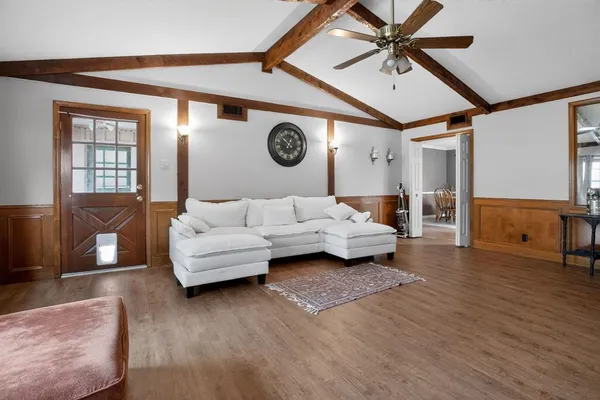 a living room with furniture and a window