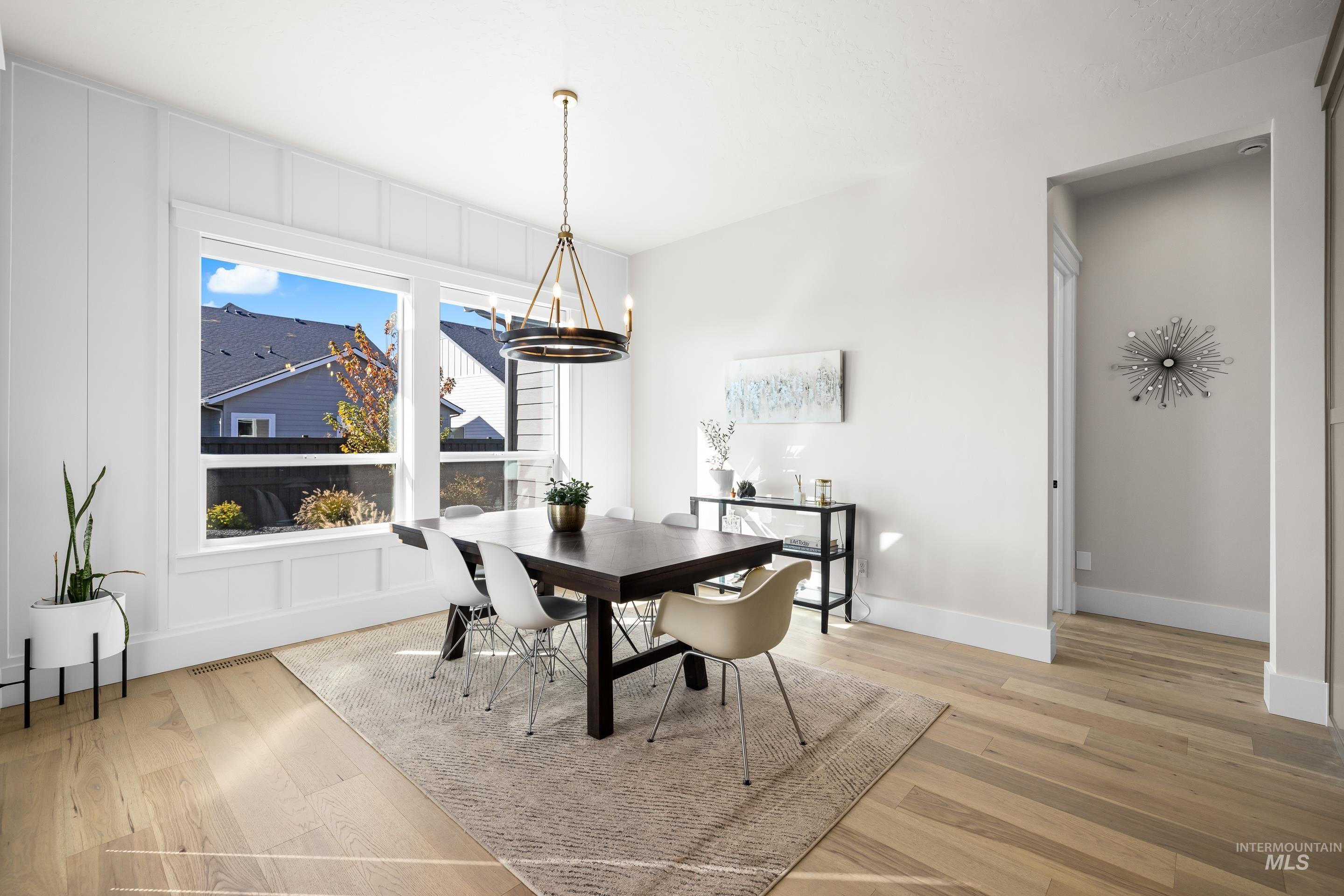 4217 North Bryant Way Meridian, ID 83646 - Photo 13 of 46 Dining area featuring a chandelier and light wood-type flooring