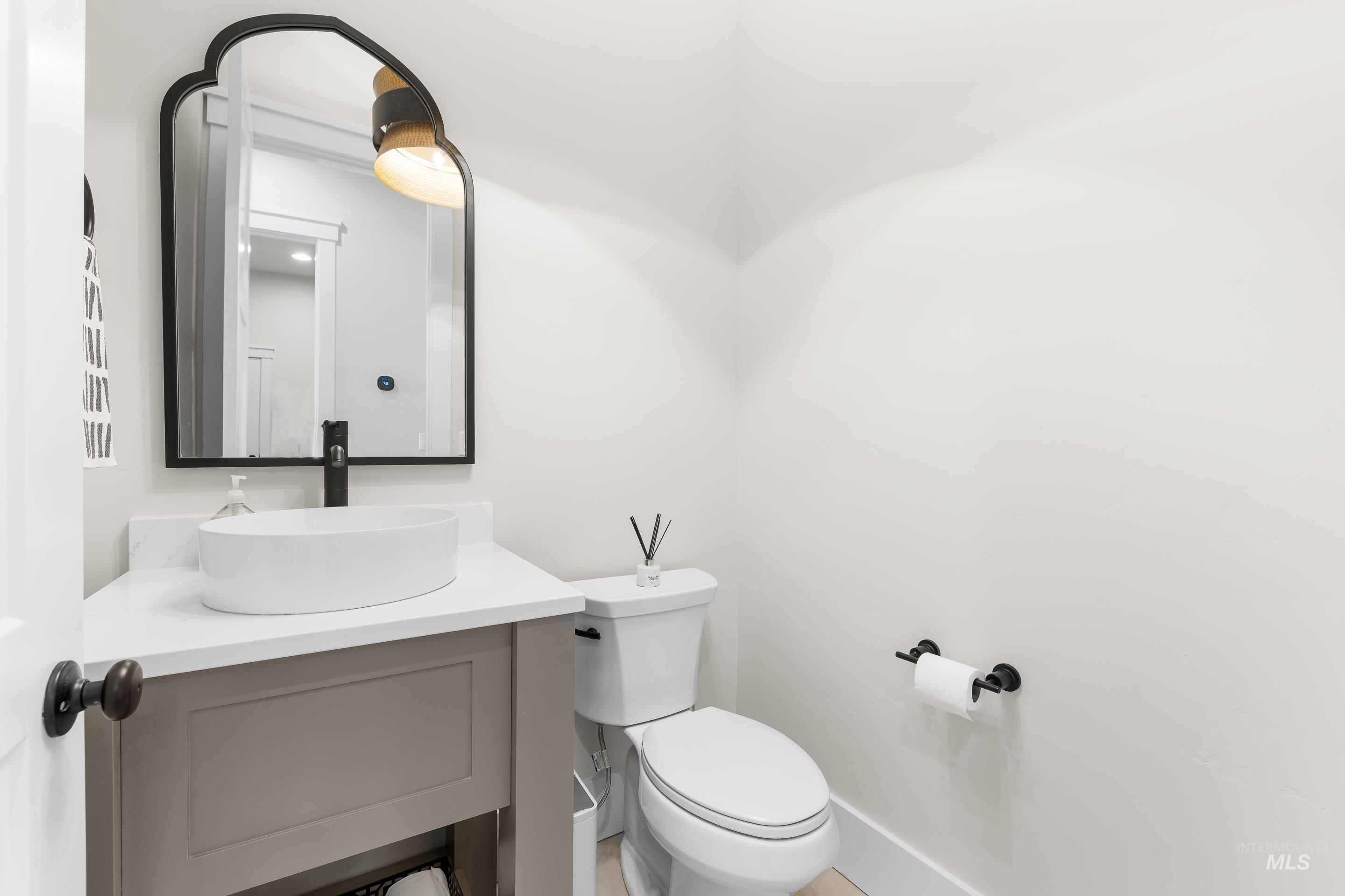 4217 North Bryant Way Meridian, ID 83646 - Photo 18 of 46 Half bathroom featuring vanity and toilet