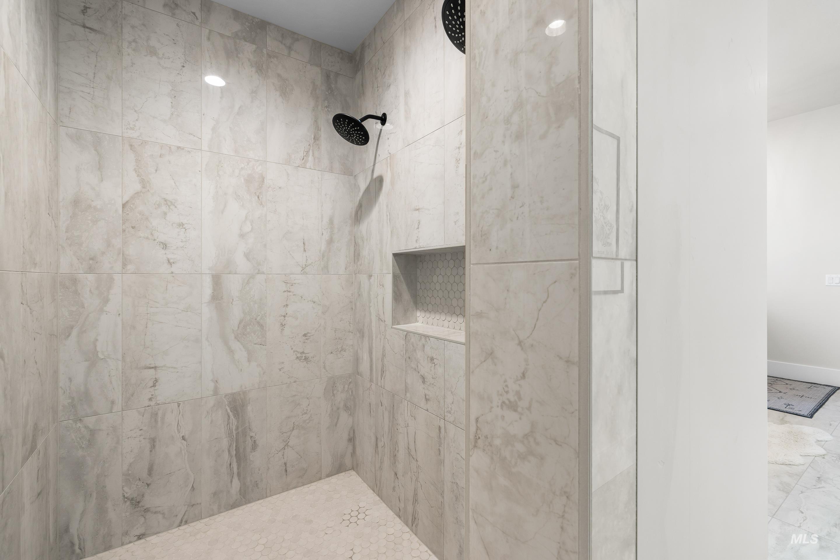 4217 North Bryant Way Meridian, ID 83646 - Photo 26 of 46 Bathroom featuring tiled shower and baseboards