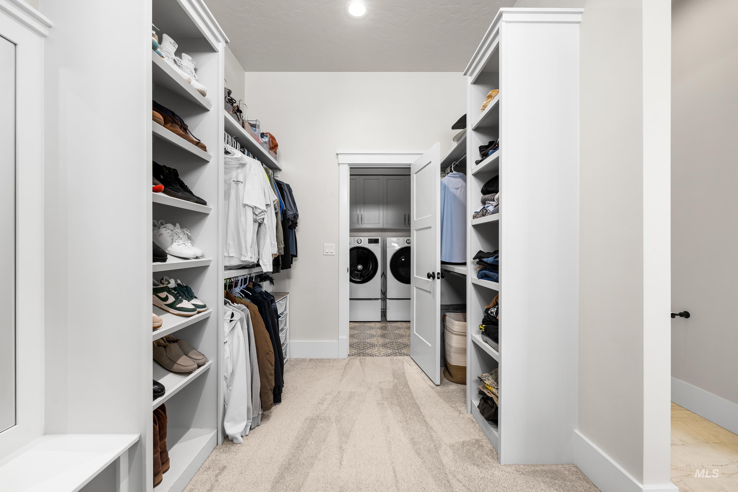 4217 North Bryant Way Meridian, ID 83646 - Photo 27 of 46 Spacious closet featuring light carpet, washing machine and clothes dryer, and water heater