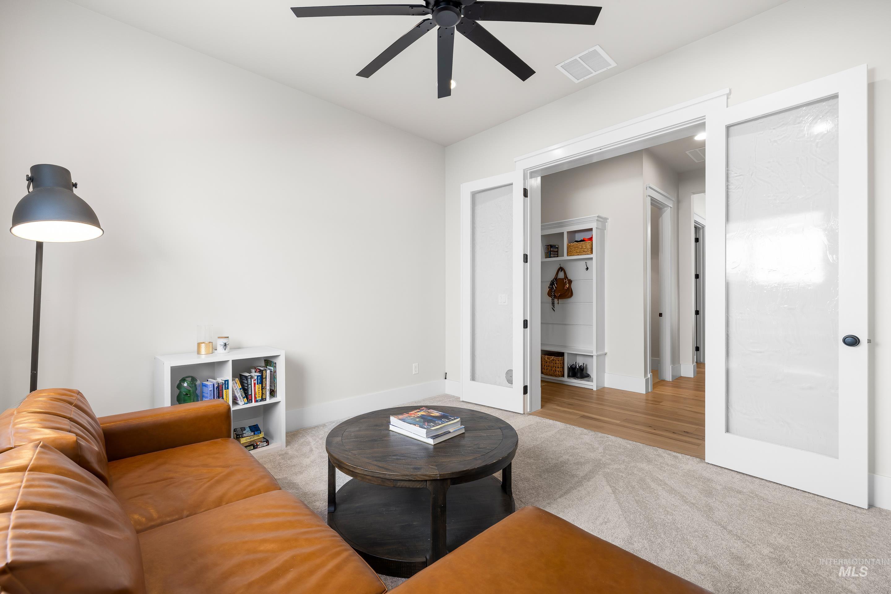 4217 North Bryant Way Meridian, ID 83646 - Photo 34 of 46 Living area featuring light colored carpet and ceiling fan