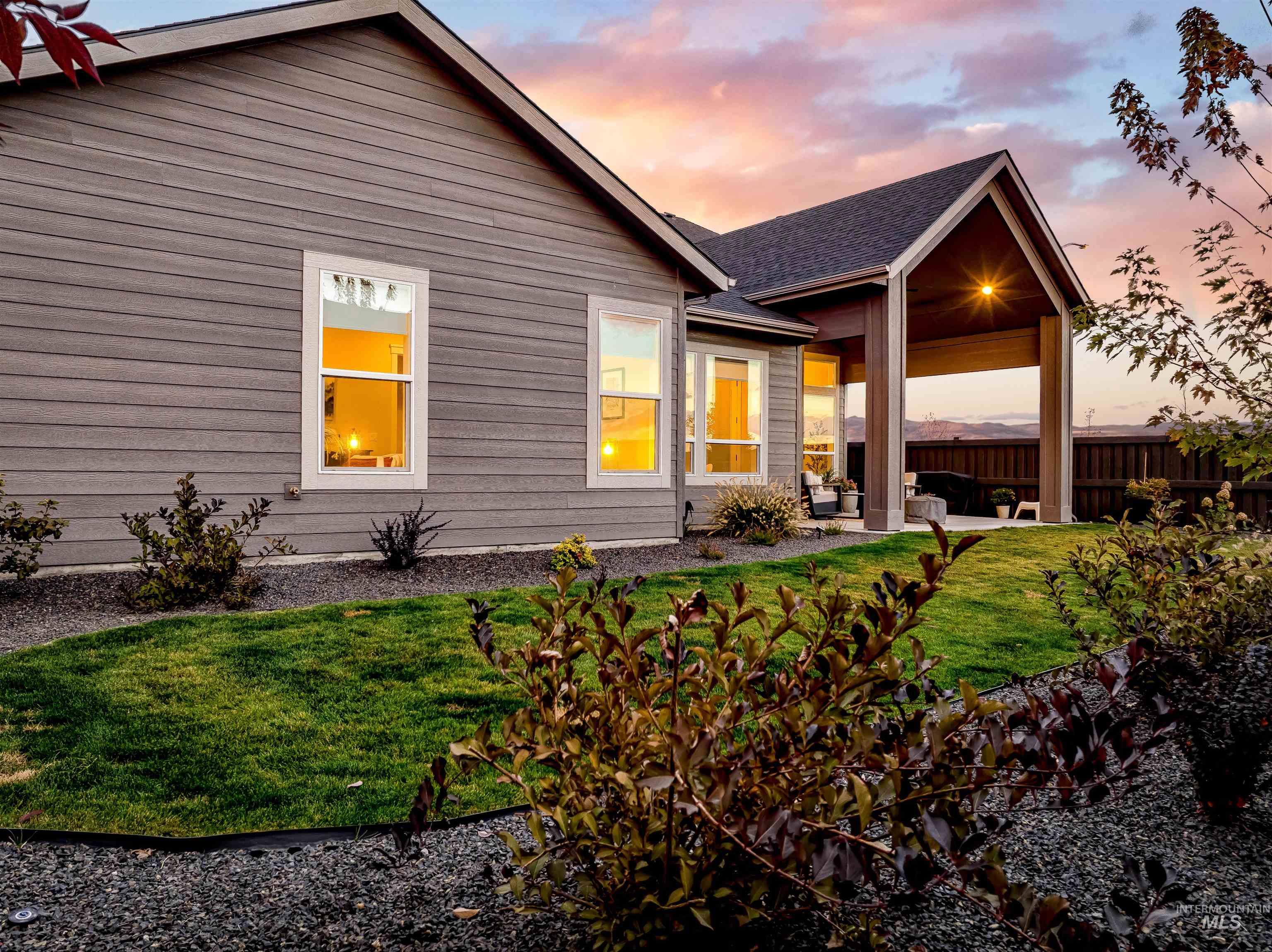 4217 North Bryant Way Meridian, ID 83646 - Photo 39 of 46 Back of house at dusk featuring a patio