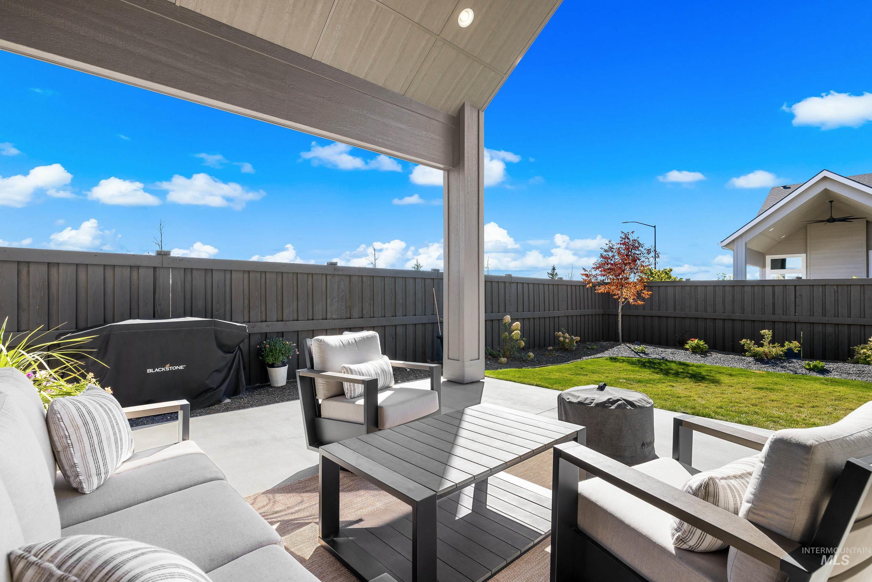 4217 North Bryant Way Meridian, ID 83646 - Photo 41 of 46 Fenced backyard featuring an outdoor hangout area and a patio