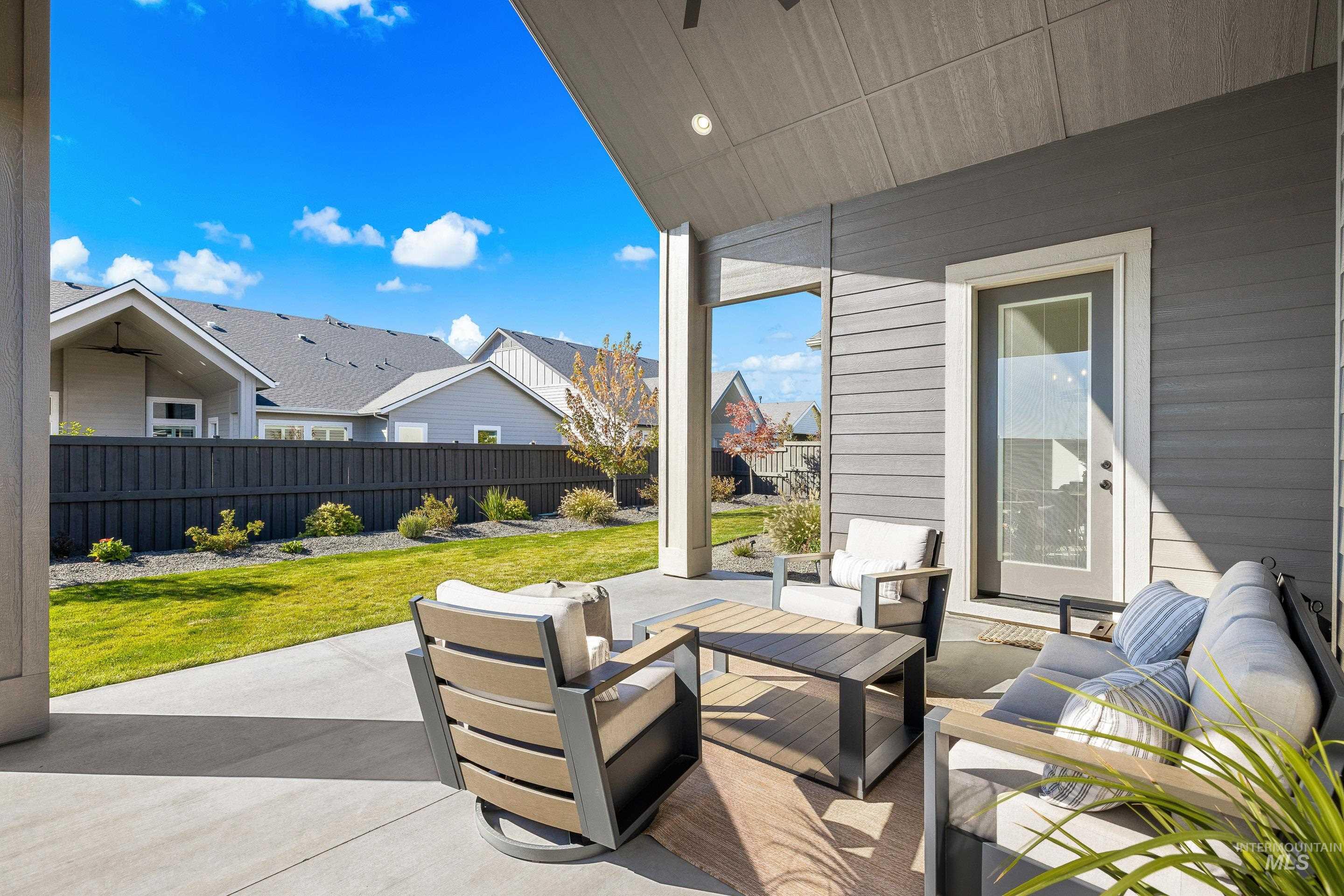 4217 North Bryant Way Meridian, ID 83646 - Photo 42 of 46 Fenced backyard with a patio, an outdoor hangout area, and a residential view