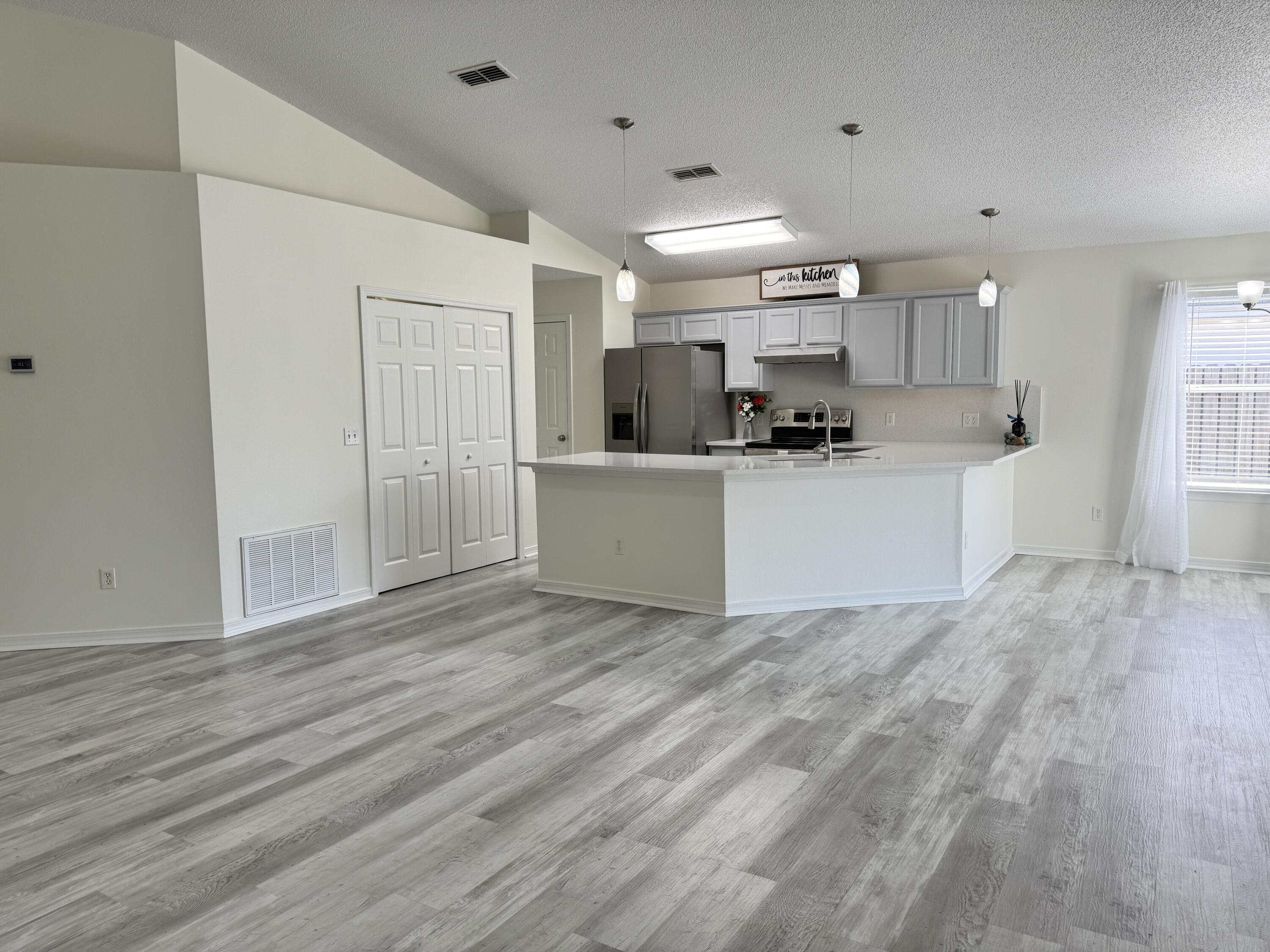 296 Limestone Circle Crestview, FL 32539 - Photo 7 of 29 Open Living/Kitchen/Dining Area