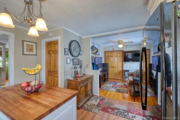 a living room with dining table and chairs
