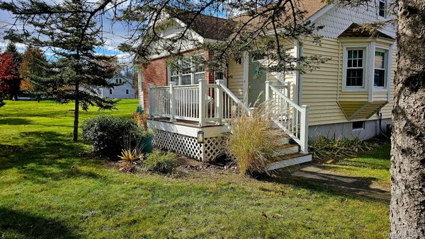 a view of a house with a yard