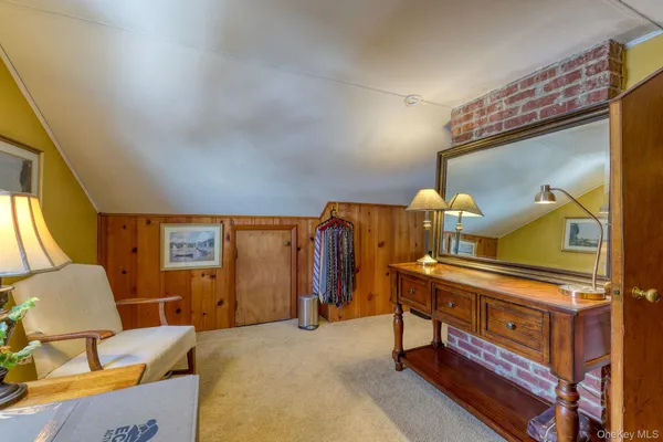 a view of a living room and bathroom