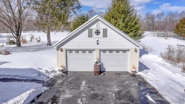 a view of a house with a yard and garage