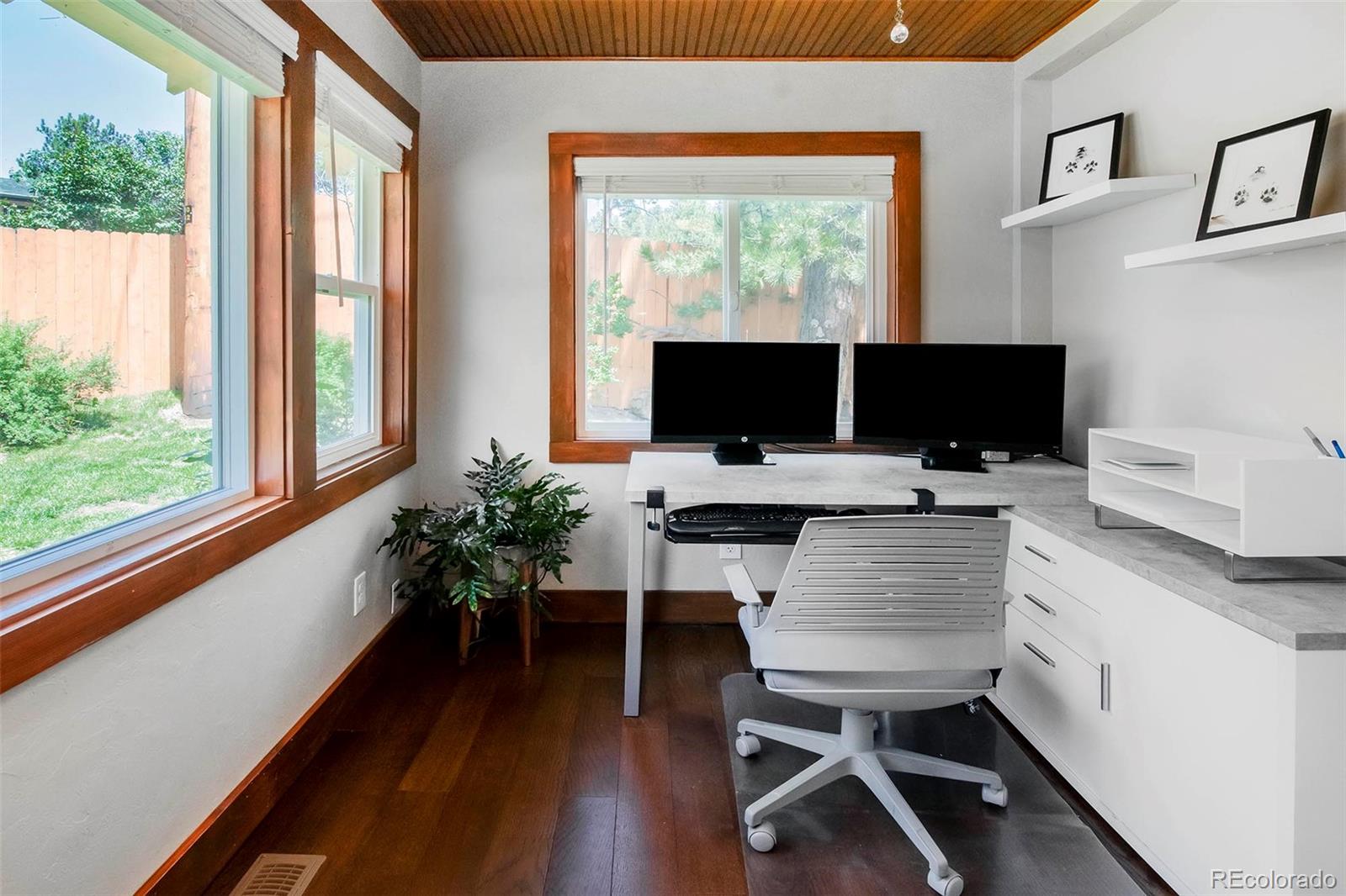 4805 Blue Spruce Road Evergreen, CO 80439 - Photo 25 of 43 a view of a workspace with furniture and a window