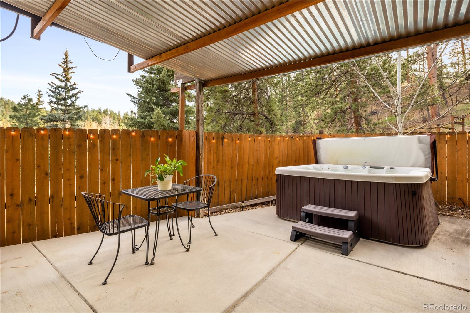 4805 Blue Spruce Road Evergreen, CO 80439 - Photo 31 of 43 a view of outdoor space with seating