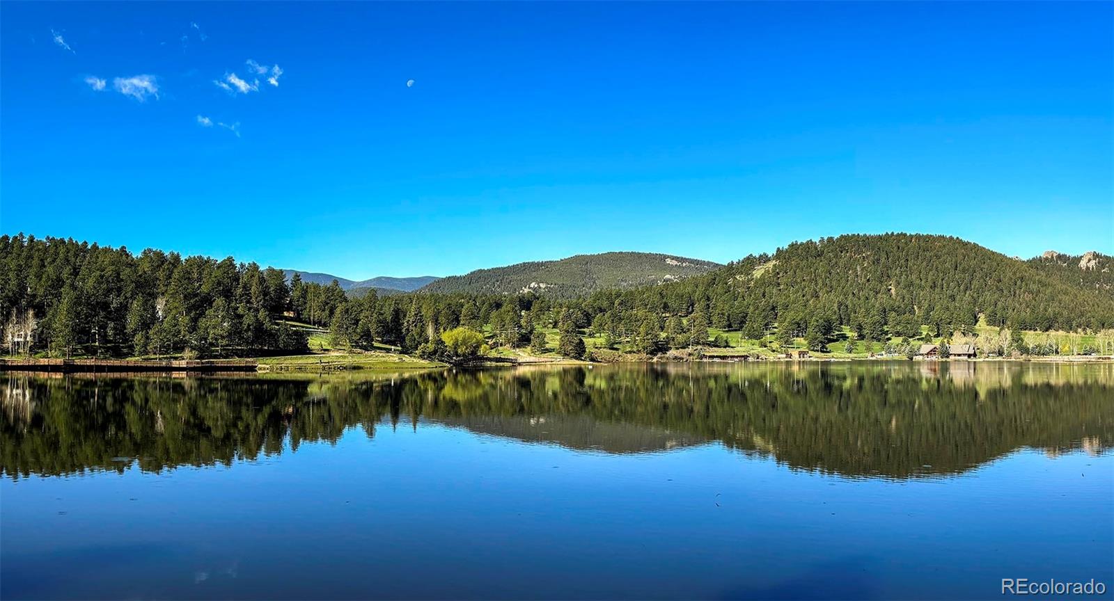 4805 Blue Spruce Road Evergreen, CO 80439 - Photo 33 of 43 a view of a lake with houses in outdoor space