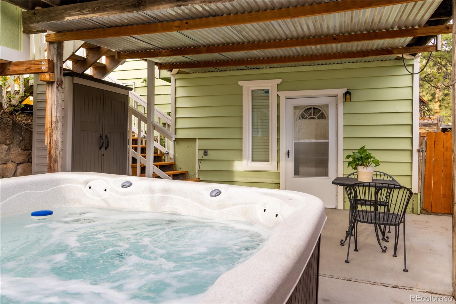 4805 Blue Spruce Road Evergreen, CO 80439 - Photo 6 of 43 a bath tub sitting in front of a house