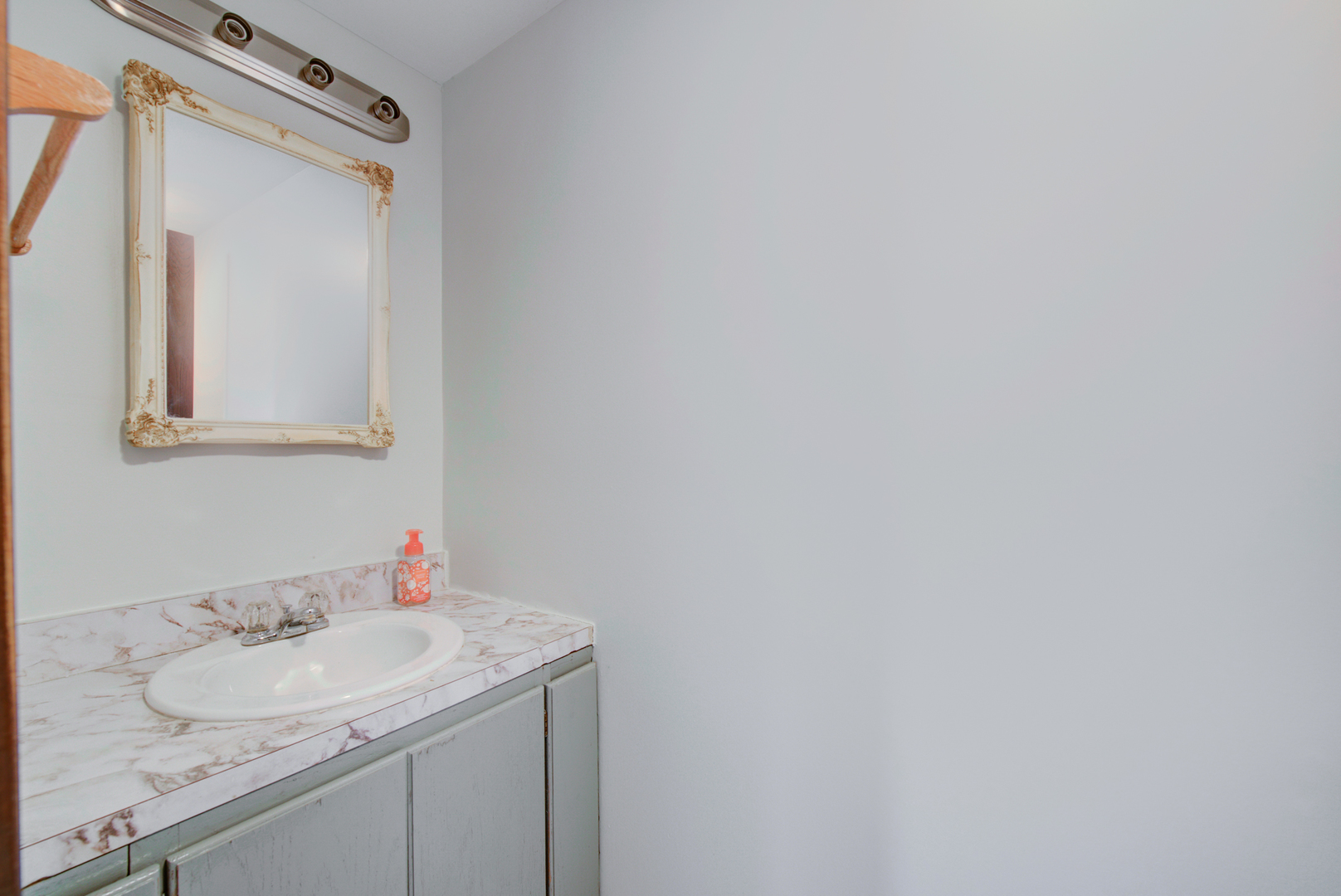 354 Rodenburg Road Roselle, IL 60172 - Photo 14 of 26 a bathroom with a granite countertop sink and a mirror