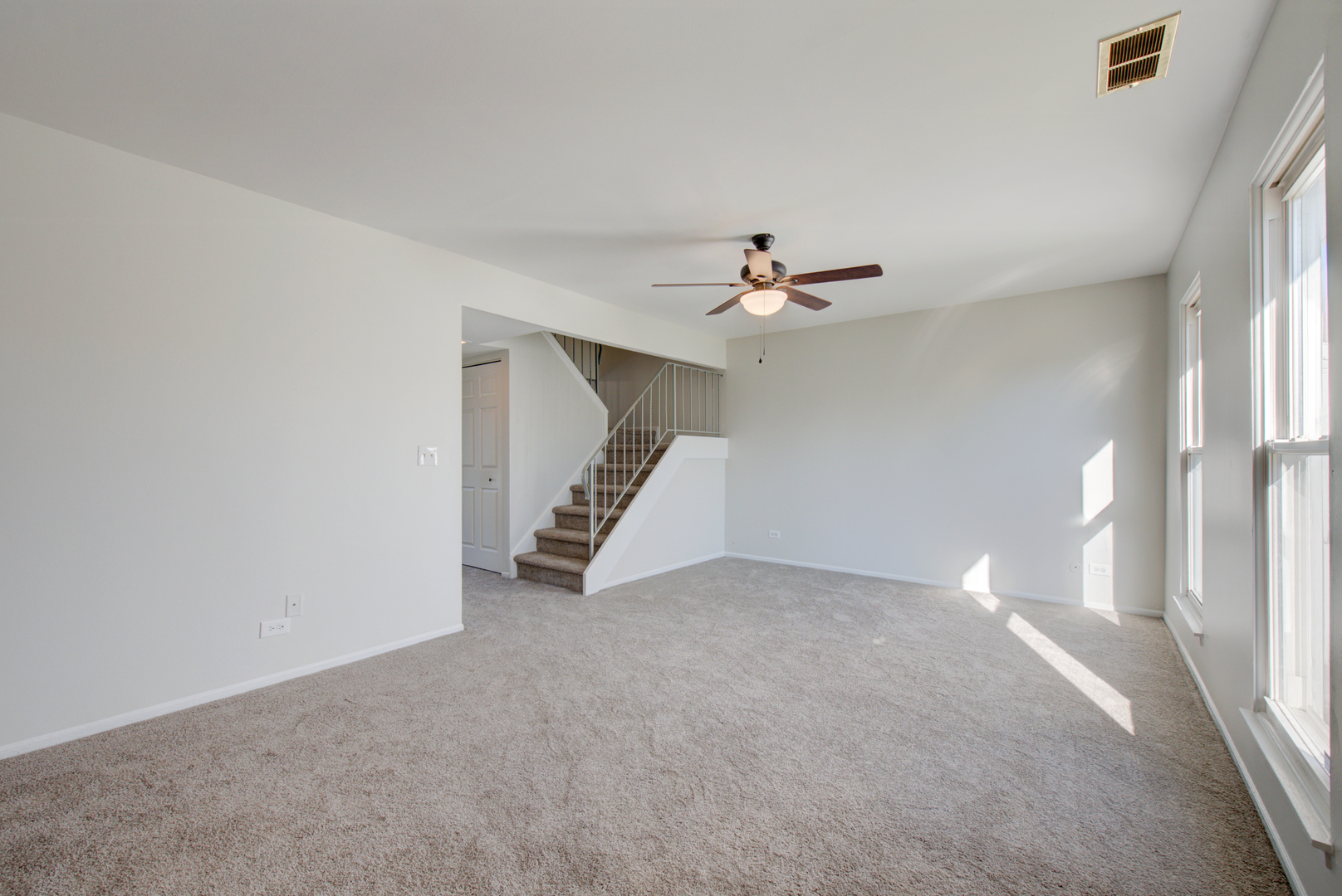 354 Rodenburg Road Roselle, IL 60172 - Photo 3 of 26 a view of an empty room with stairs