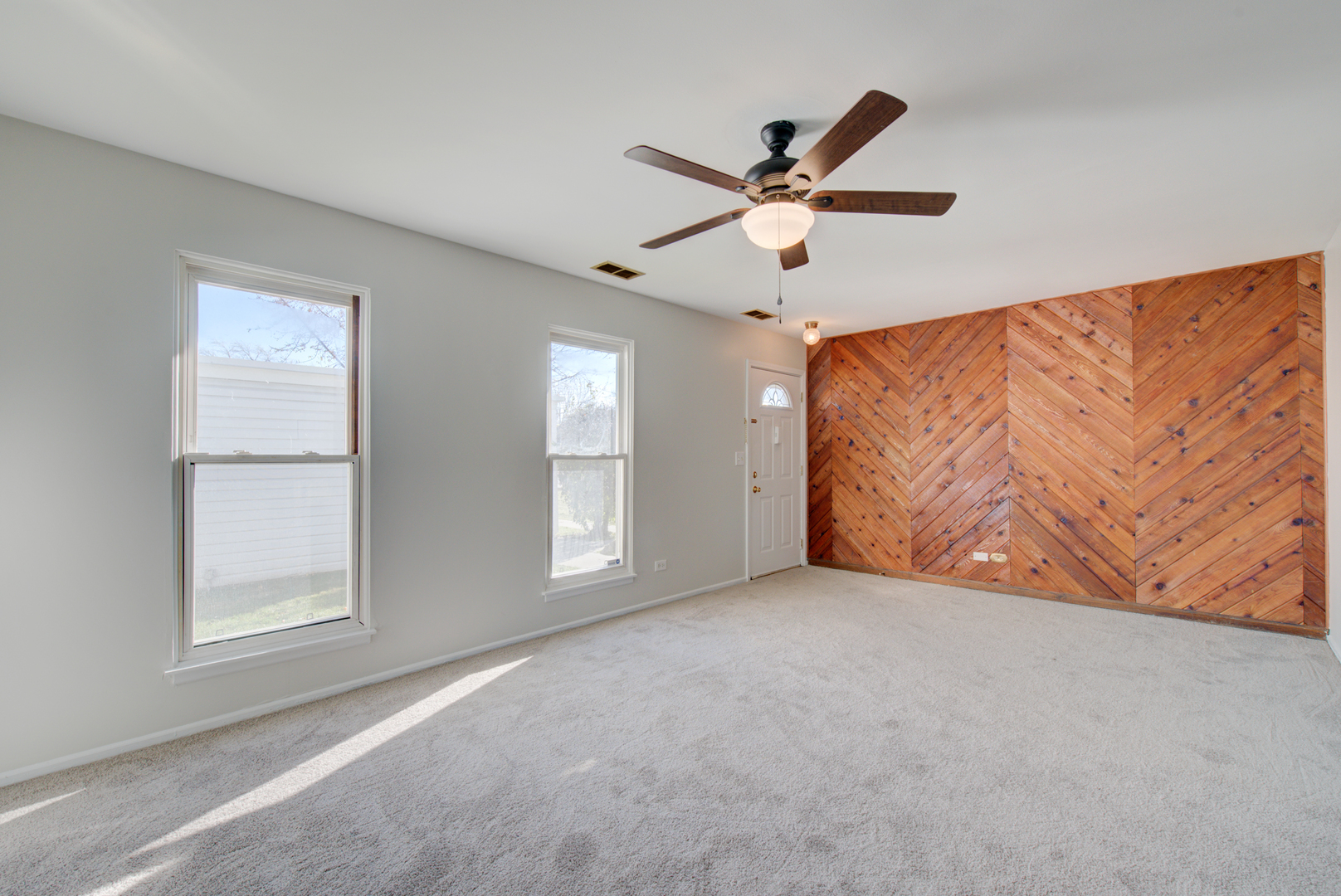 354 Rodenburg Road Roselle, IL 60172 - Photo 5 of 26 wooden floor in an empty room with a window