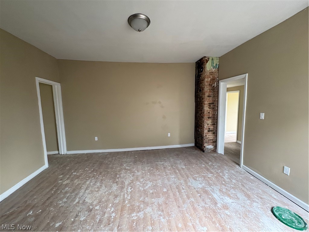 1210 Lawrence Road Northeast Canton, OH 44705 - Photo 24 of 38 Exposed brick column, recessed doorways, ceiling-mounted light fixture