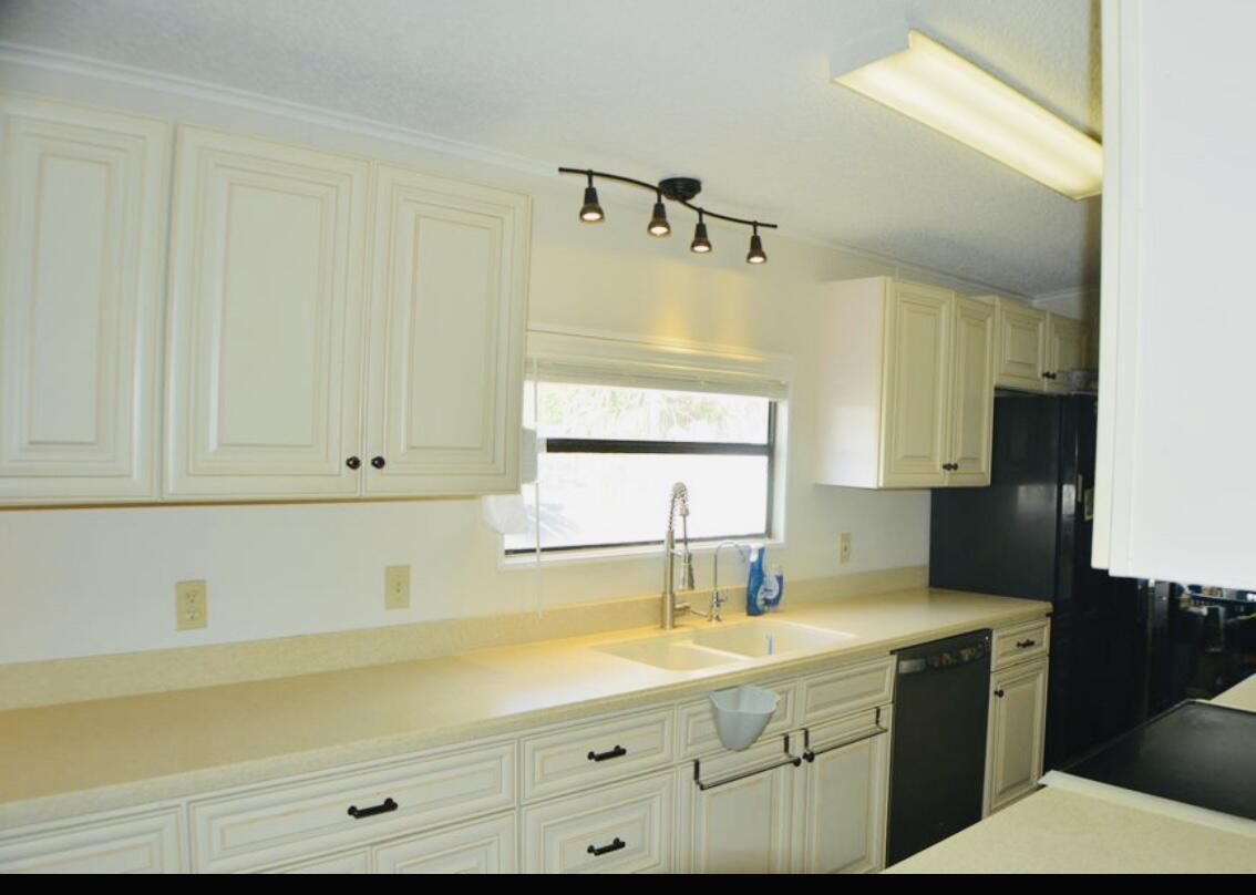 6554 Highway 441 Okeechobee, FL 34974 - Photo 11 of 22 a bathroom with a sink and a mirror