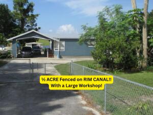 6554 Highway 441 Okeechobee, FL 34974 - Photo 3 of 22 a sign that is on the side of a road