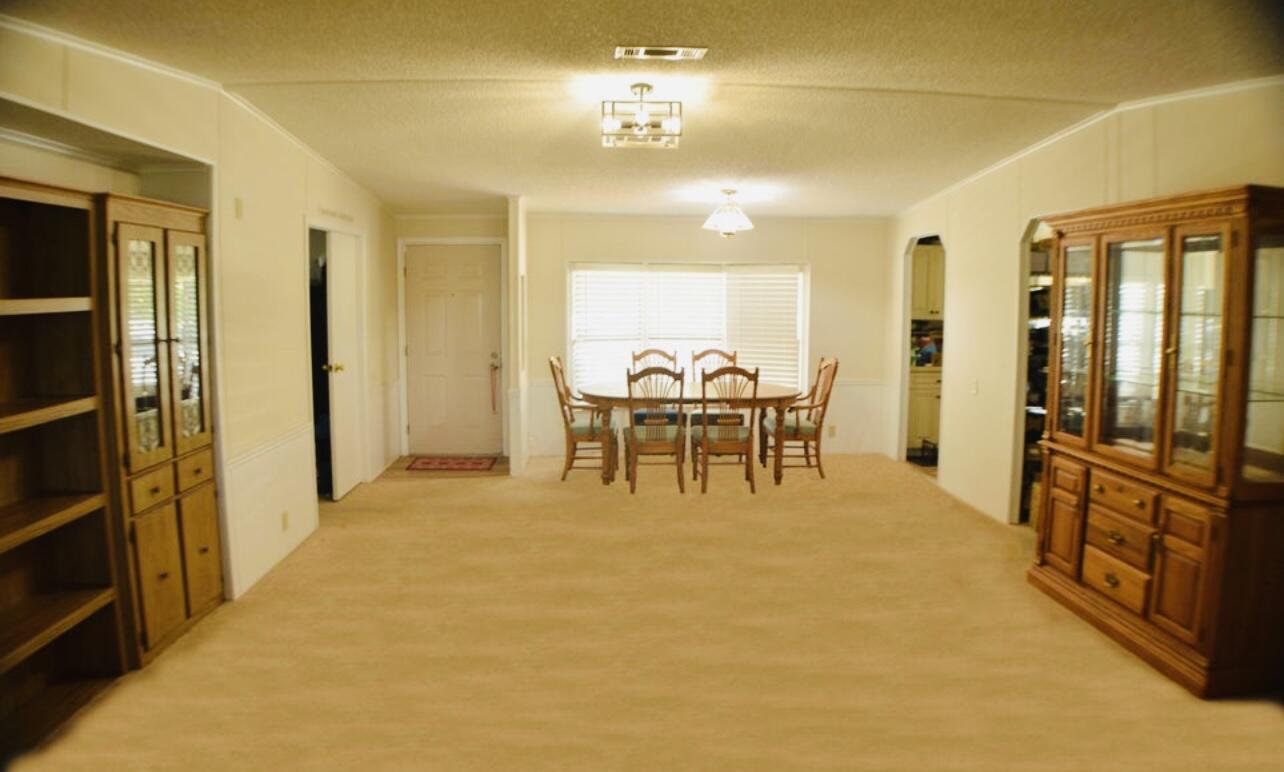 6554 Highway 441 Okeechobee, FL 34974 - Photo 7 of 22 a view of a room with furniture and wooden floor