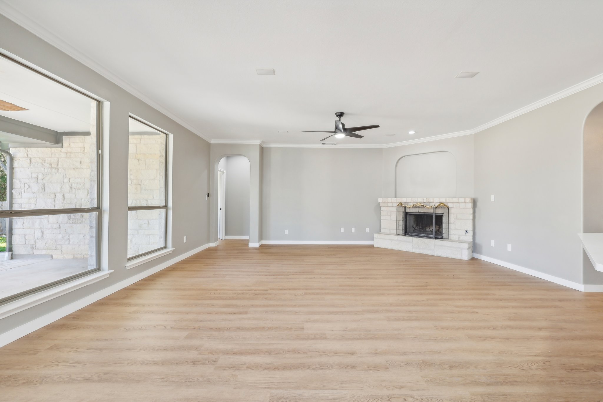 7324 Moon Rock Road Austin, TX 78739 - Photo 5 of 30 a view of an empty room with a window and wooden floor