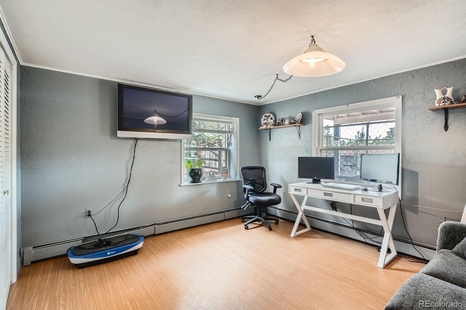 34886 Mohawk Trail Pine, CO 80470 - Photo 11 of 34 a view of a livingroom with workspace and a window