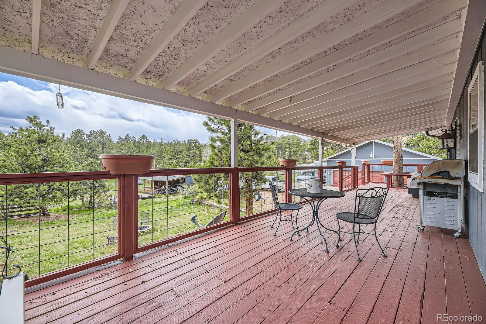 34886 Mohawk Trail Pine, CO 80470 - Photo 14 of 34 a view of chairs with wooden floor
