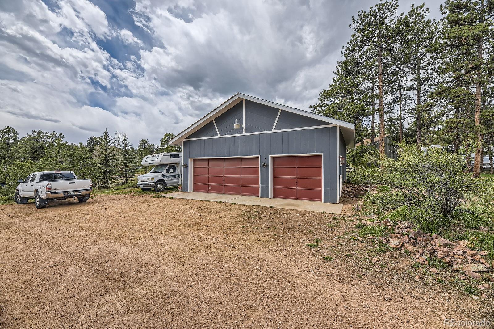 34886 Mohawk Trail Pine, CO 80470 - Photo 16 of 34 a house with a outdoor space