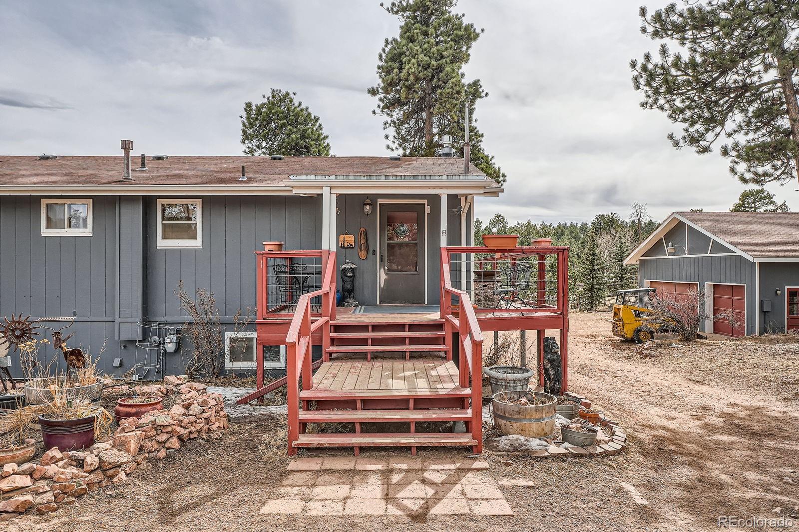 34886 Mohawk Trail Pine, CO 80470 - Photo 2 of 34 a front view of a house