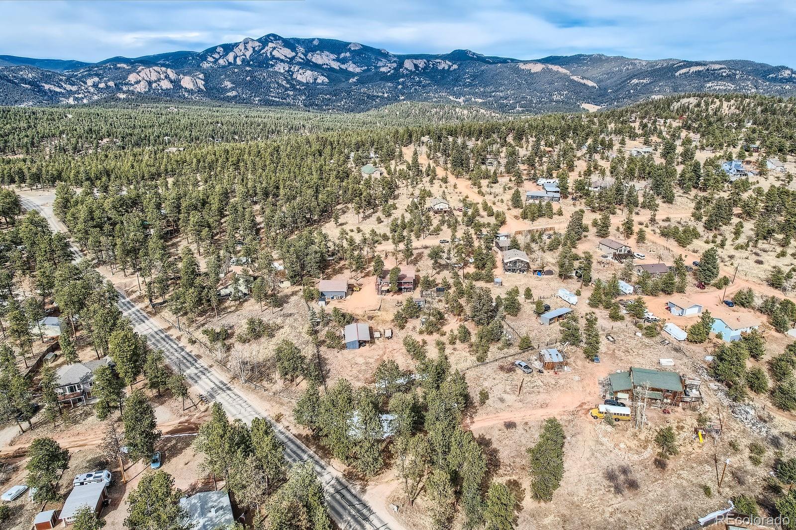 34886 Mohawk Trail Pine, CO 80470 - Photo 31 of 34 a view of an outdoor space with a mountain