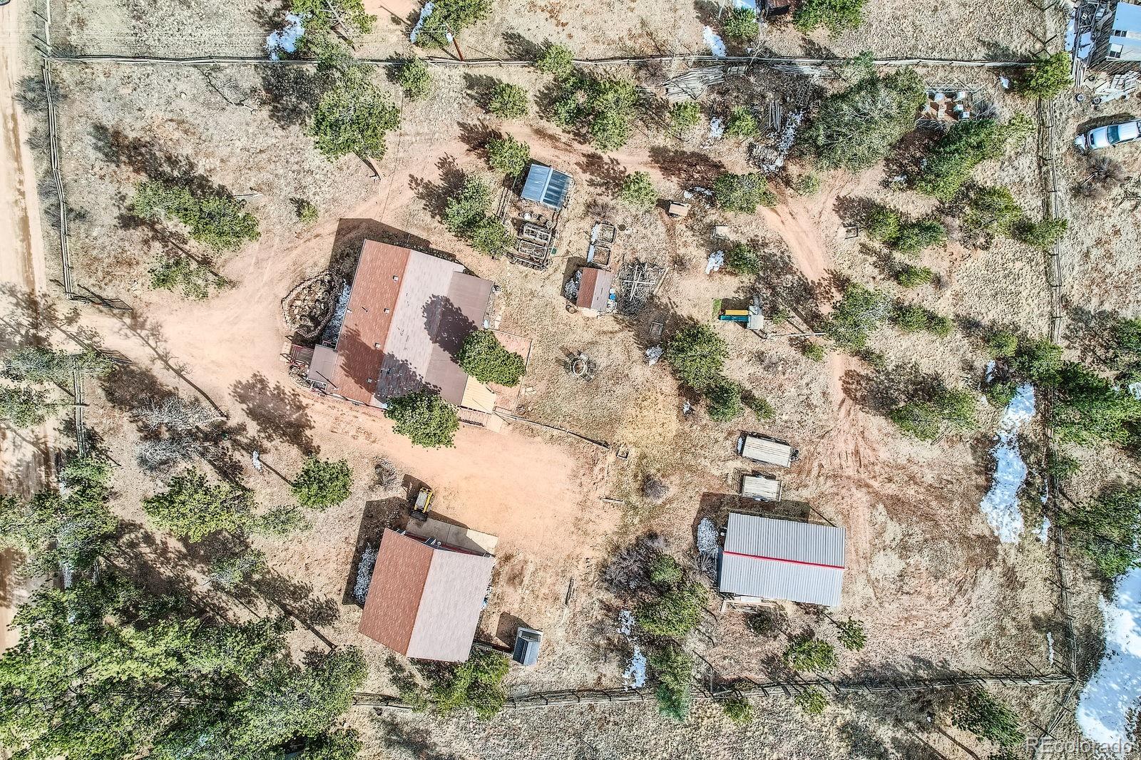 34886 Mohawk Trail Pine, CO 80470 - Photo 34 of 34 a aerial view of a house with a yard