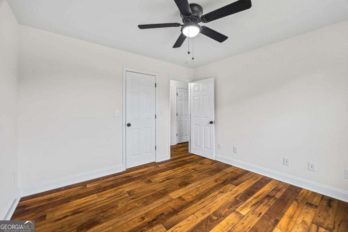 0 Ed Bennett Road Nicholson, GA 30565 - Photo 42 of 70 an empty room with a ceiling fan