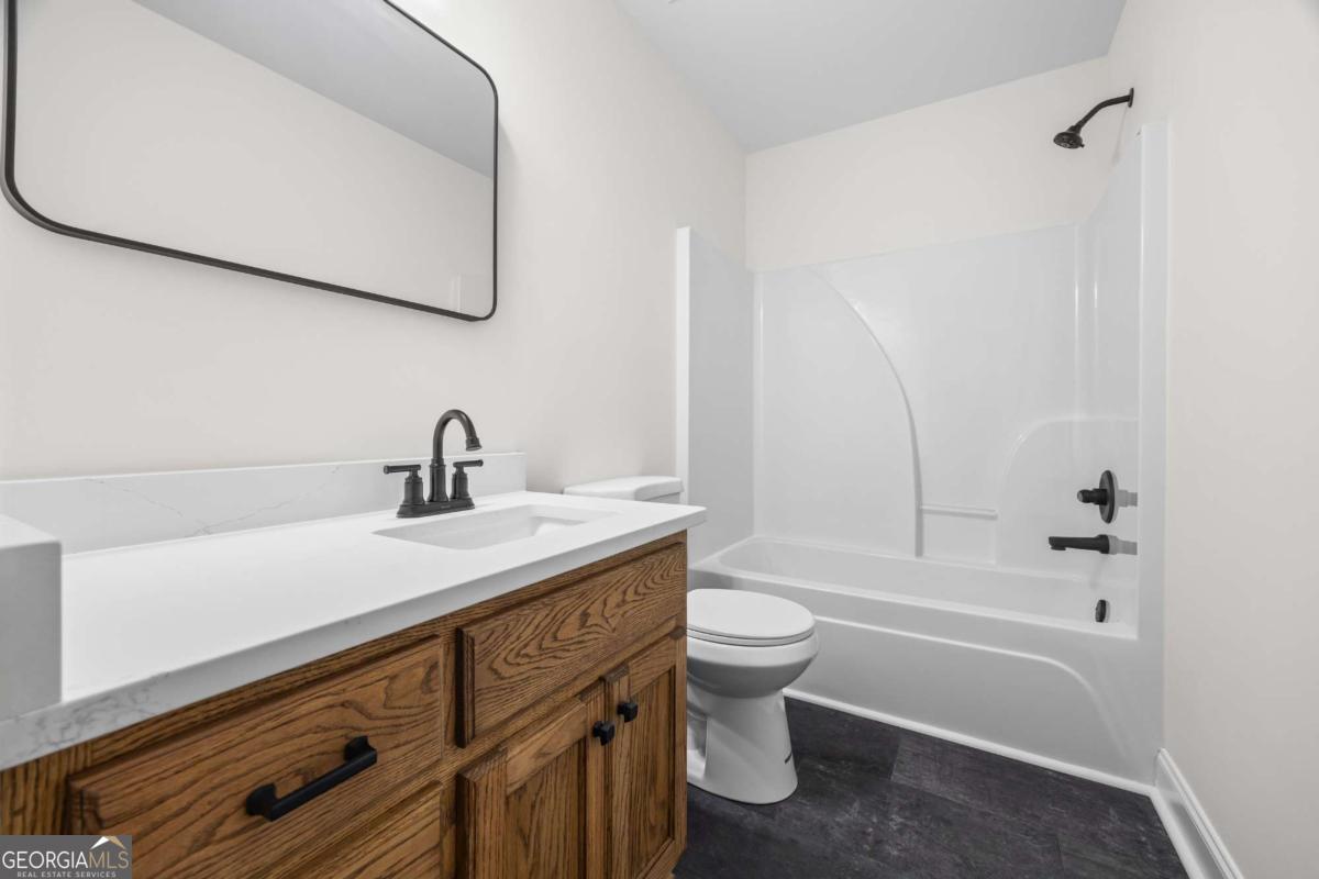 0 Ed Bennett Road Nicholson, GA 30565 - Photo 46 of 70 a bathroom with a sink a toilet and shower
