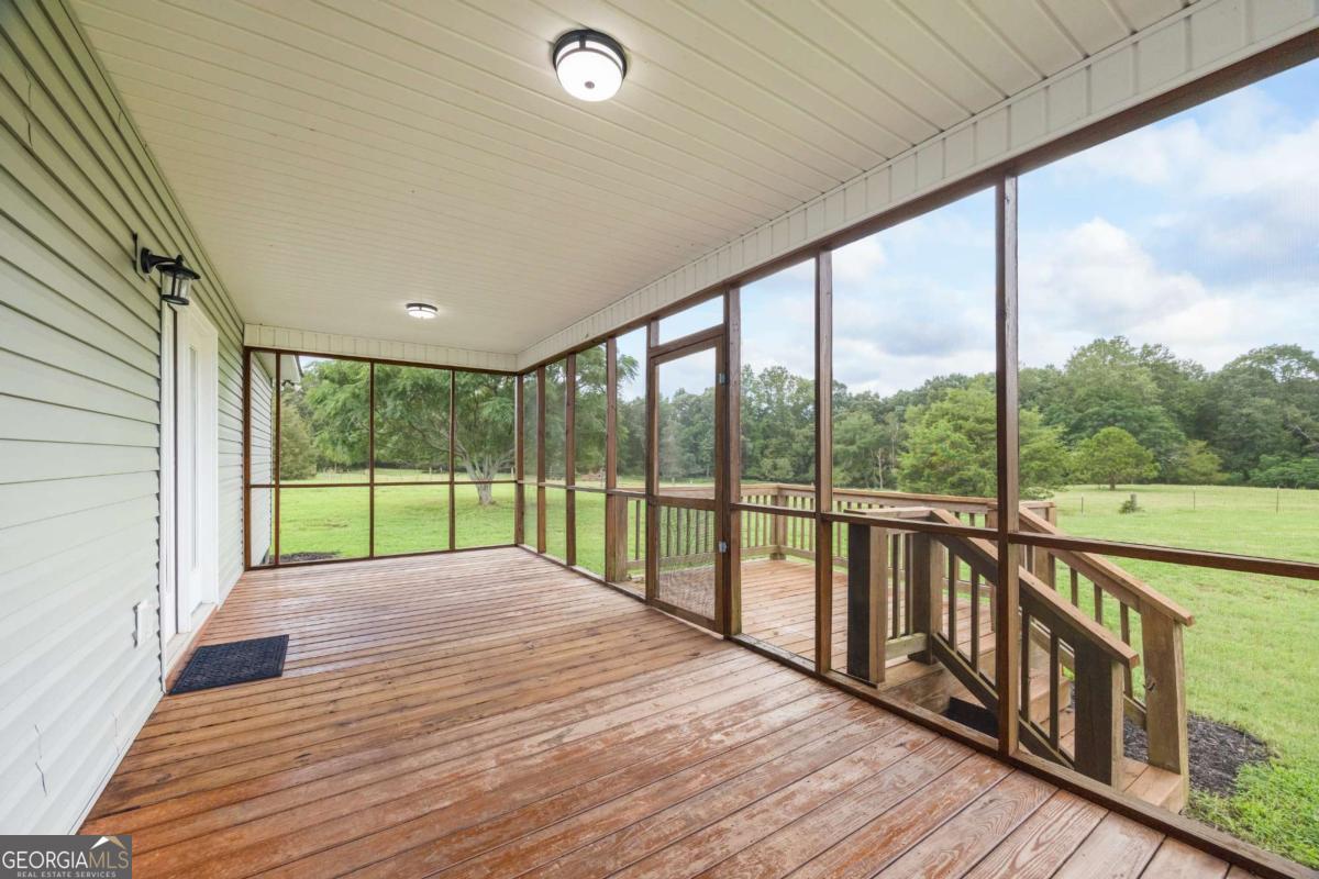 0 Ed Bennett Road Nicholson, GA 30565 - Photo 62 of 70 a view of a deck with wooden floor and fence
