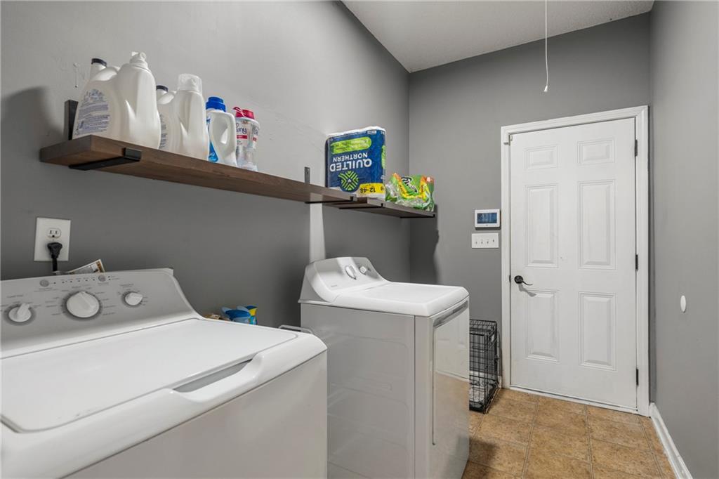 234 Owens Road Fort Mitchell, AL 36856 - Photo 23 of 25 Washroom featuring independent washer and dryer and baseboards