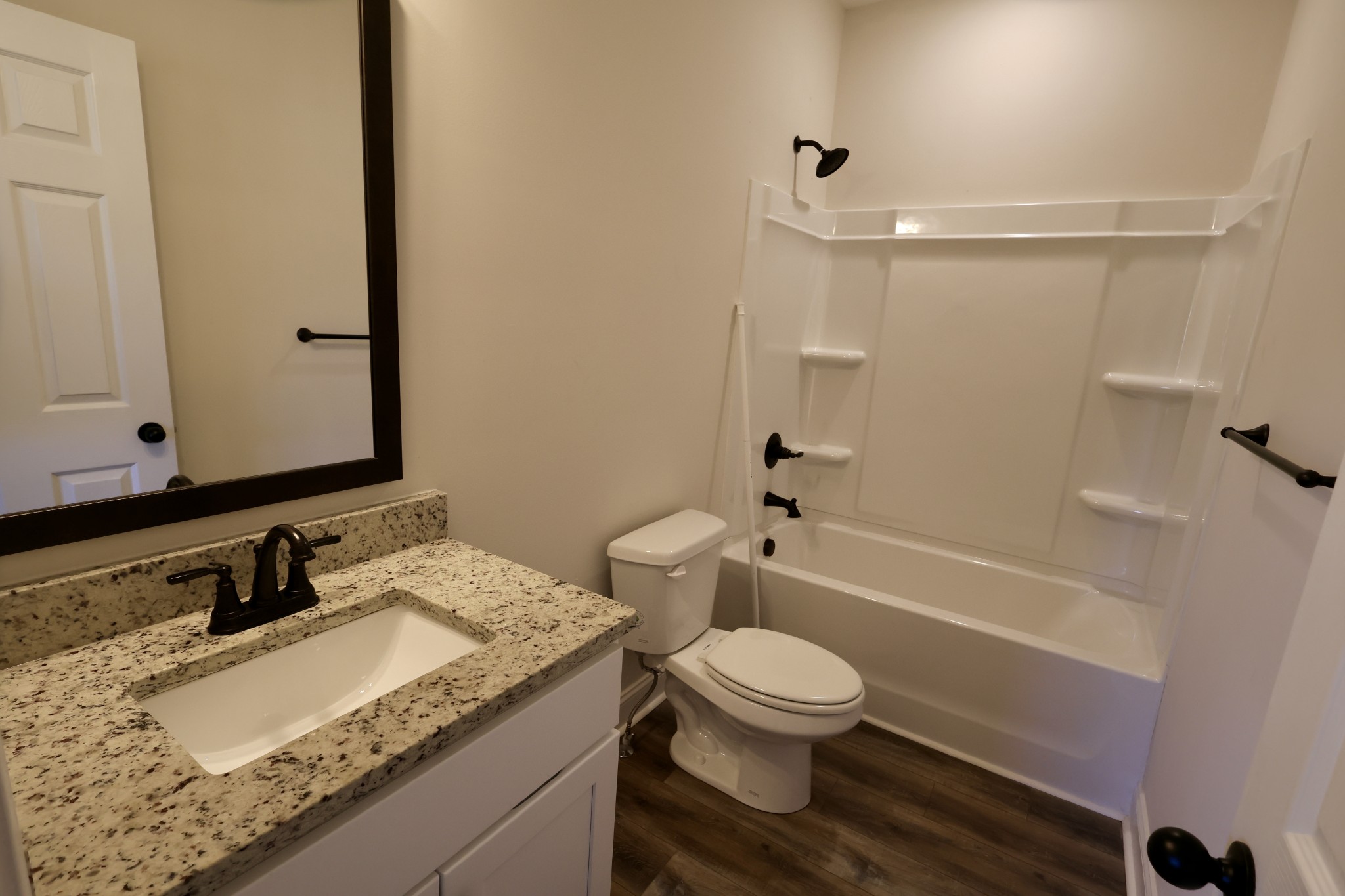 500 Peachers Mill Road, Unit B4 Clarksville, TN 37042 - Photo 14 of 26 a bathroom with a granite countertop sink toilet and shower